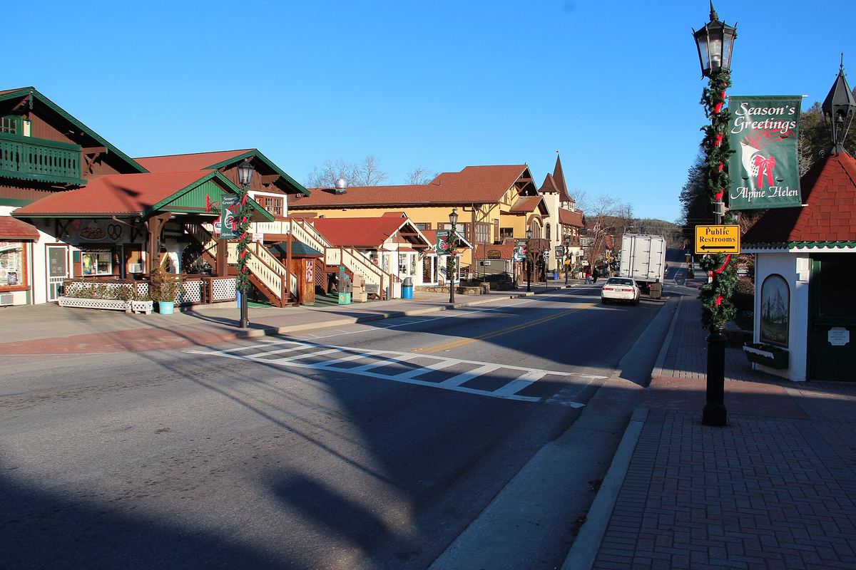 Bavarian-style storefronts and a lamppost on a sunny street in downtown Helen