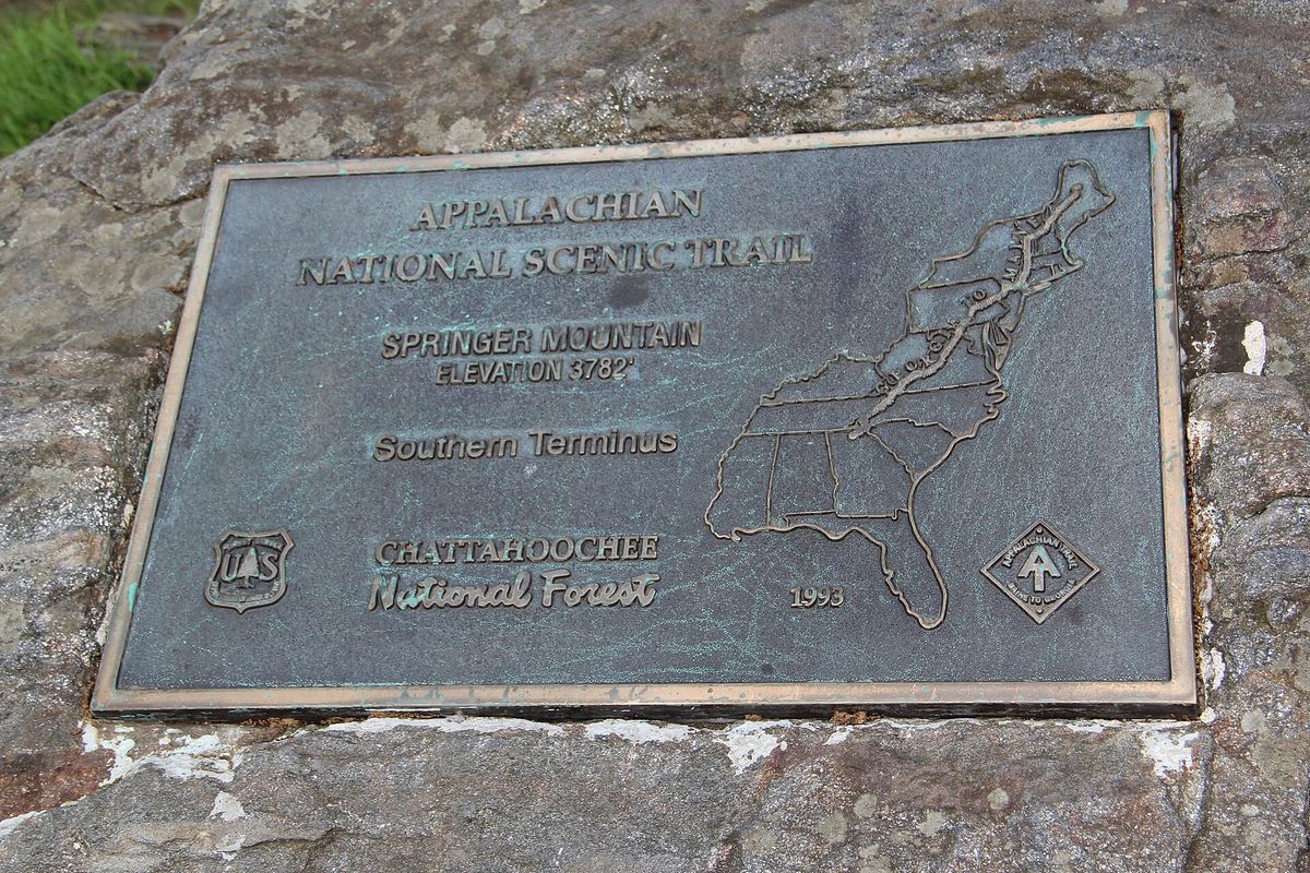 Bronze Appalachian Trail plaque set in rock at the top of Springer Mountain